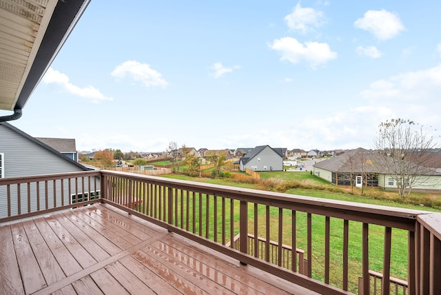 wooden terrace with a yard