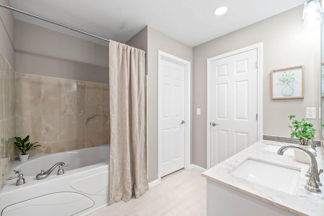 bathroom with vanity and shower / bath combo with shower curtain