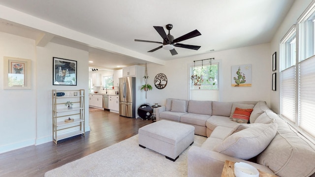 living room with hardwood / wood-style flooring, sink, a wealth of natural light, and ceiling fan