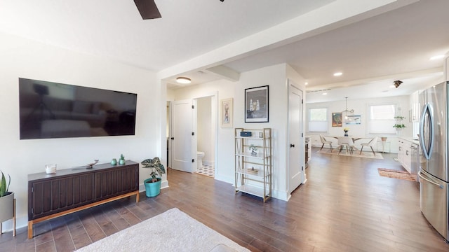 living room with hardwood / wood-style floors and ceiling fan