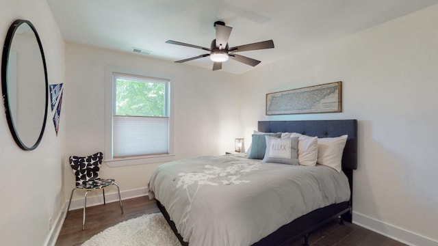 bedroom with dark wood-type flooring and ceiling fan