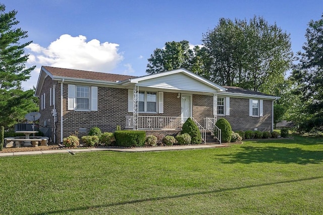 single story home with a porch and a front yard