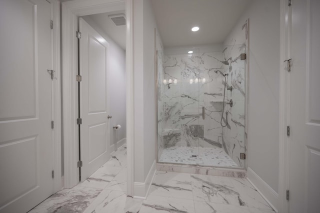 bathroom with a shower with shower door