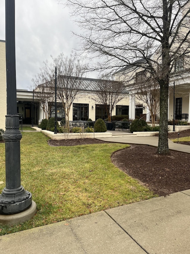 exterior space featuring a front lawn