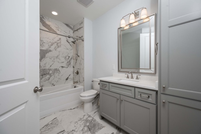 full bathroom with vanity, toilet, and tiled shower / bath combo