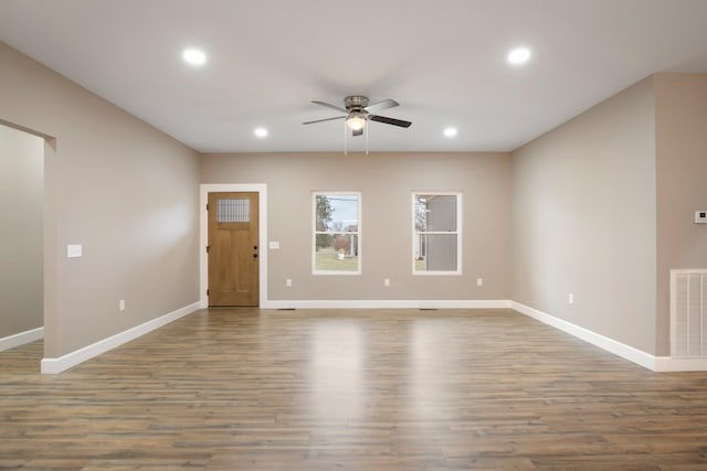 interior space featuring baseboards, visible vents, a ceiling fan, wood finished floors, and recessed lighting