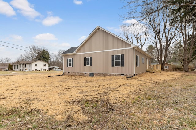 view of side of property featuring crawl space