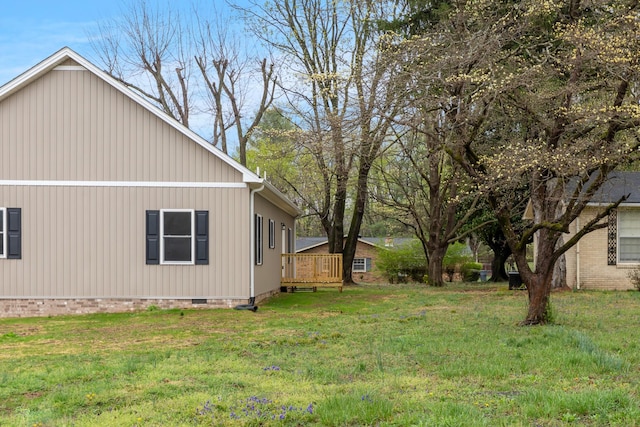 view of yard with a wooden deck