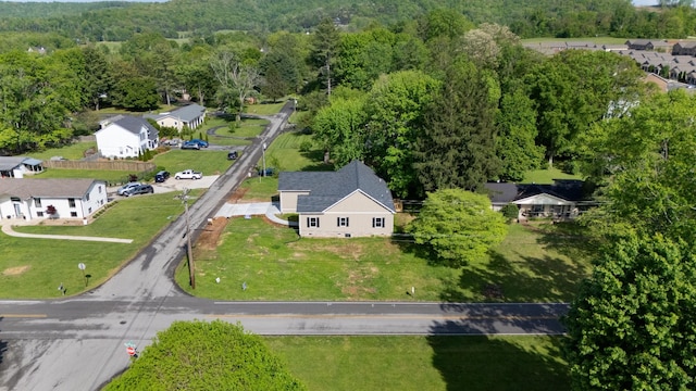 bird's eye view with a forest view and a residential view