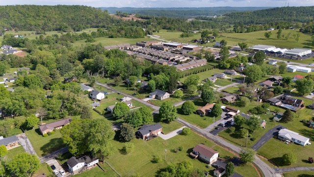 birds eye view of property with a forest view