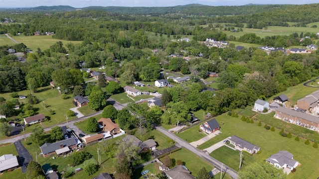 aerial view featuring a view of trees and a residential view