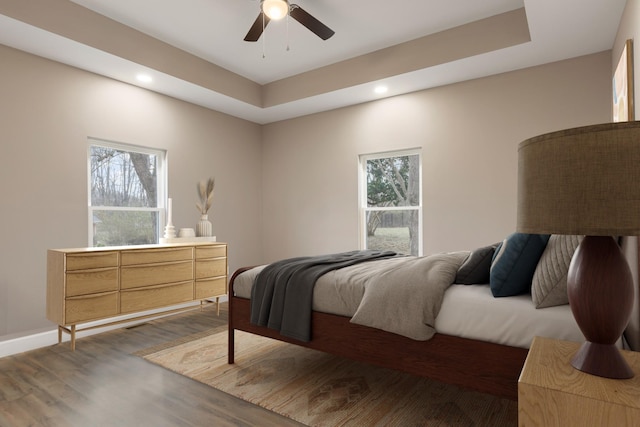 bedroom featuring recessed lighting, baseboards, ceiling fan, and wood finished floors