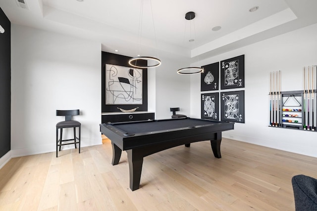 playroom with a raised ceiling, light wood-type flooring, and billiards