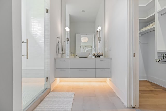 bathroom with vanity and an enclosed shower