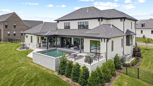 back of house with an outdoor living space, central AC unit, a yard, a swimming pool with hot tub, and a patio