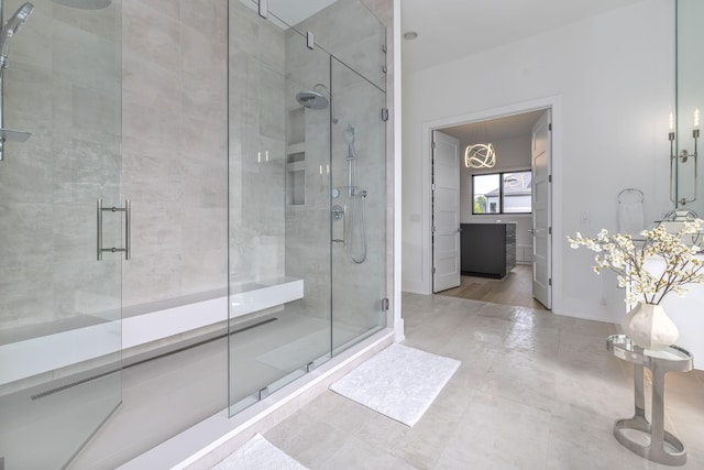 bathroom with a shower with shower door