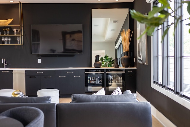 living room featuring indoor wet bar and beverage cooler