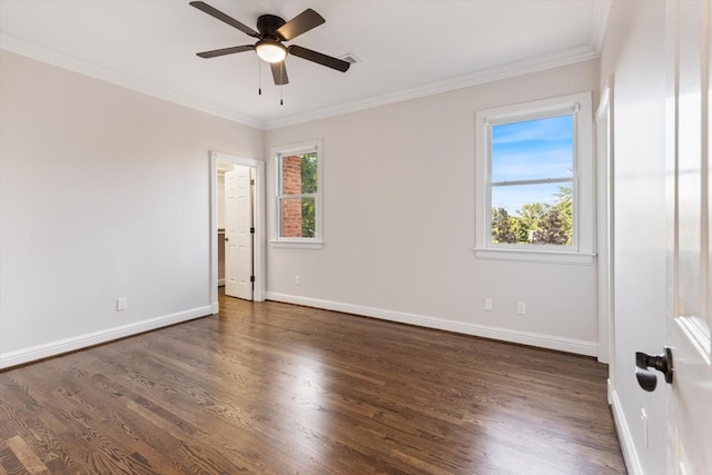 unfurnished room with ornamental molding, a healthy amount of sunlight, and dark hardwood / wood-style floors