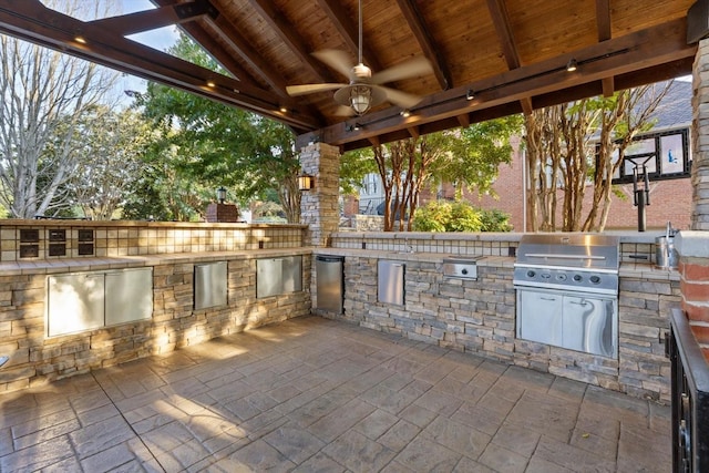 view of patio / terrace with area for grilling and ceiling fan