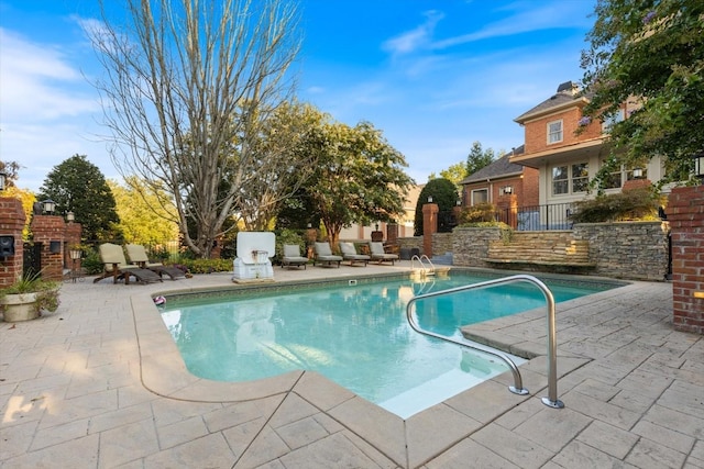 view of swimming pool featuring a patio