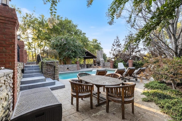 view of patio / terrace with a fenced in pool