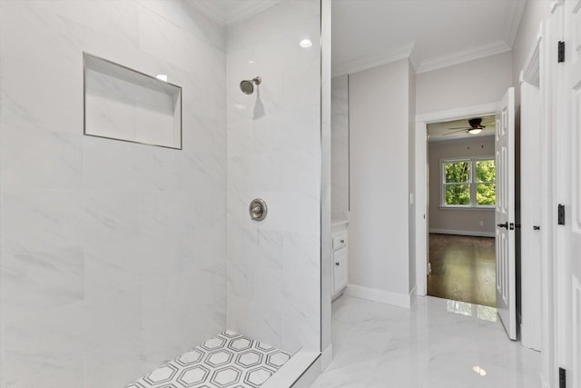 bathroom with crown molding and tiled shower