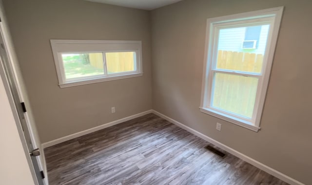 spare room with hardwood / wood-style flooring