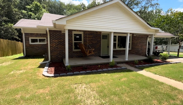 view of front facade with covered porch and a front lawn