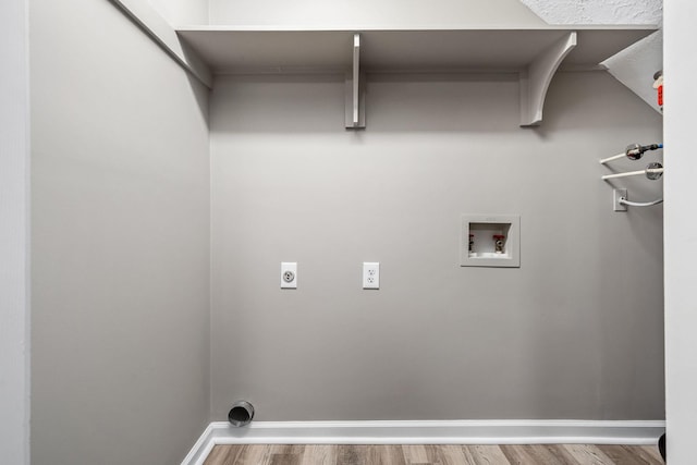 washroom featuring electric dryer hookup, washer hookup, and hardwood / wood-style flooring