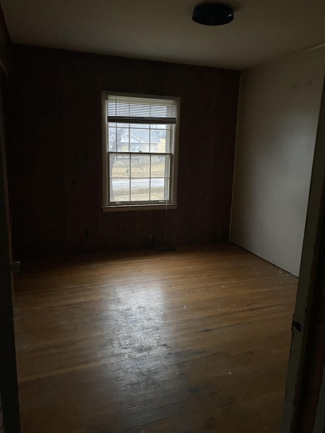 empty room featuring wood-type flooring