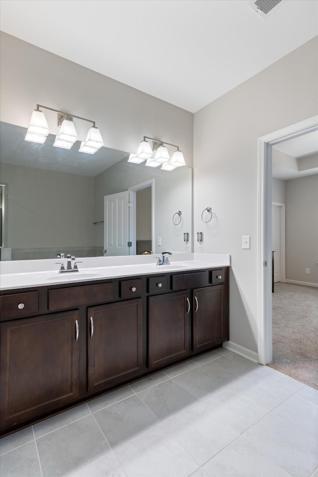 bathroom featuring tile patterned floors and vanity