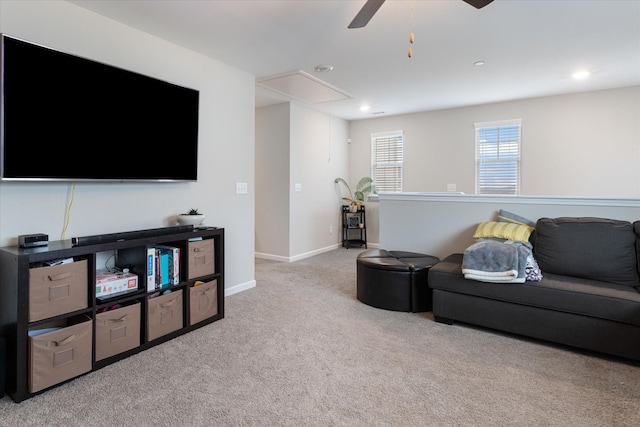 living room with light carpet and ceiling fan