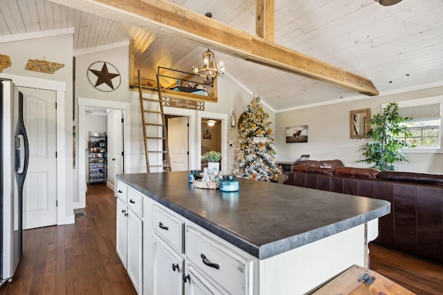 kitchen featuring dark hardwood / wood-style flooring, stainless steel fridge with ice dispenser, vaulted ceiling with beams, and white cabinets