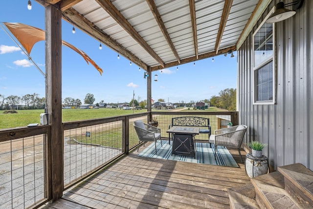 wooden deck featuring a yard