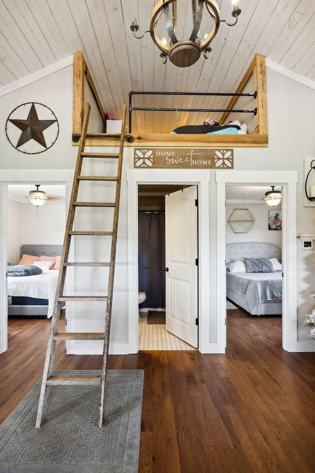 interior space with vaulted ceiling, dark hardwood / wood-style floors, and wooden ceiling