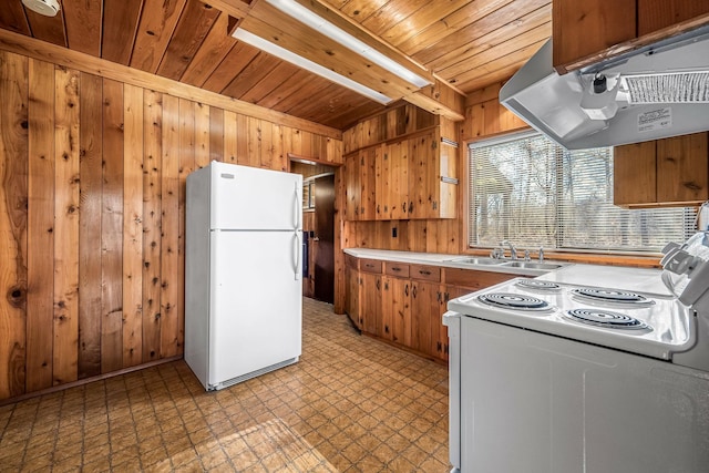 kitchen featuring sink, wood walls, wood ceiling, white appliances, and range hood