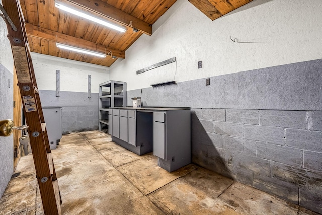 kitchen featuring vaulted ceiling with beams and wooden ceiling