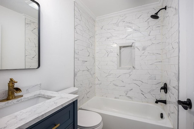 full bathroom with crown molding, vanity, toilet, and tiled shower / bath combo