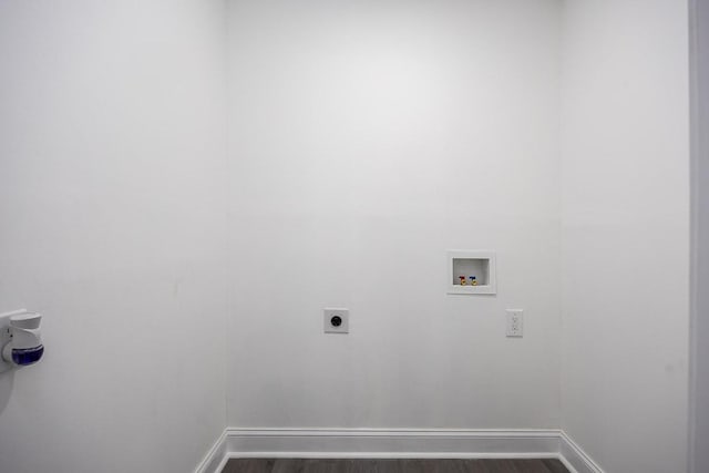 laundry area with dark wood-type flooring, washer hookup, and hookup for an electric dryer