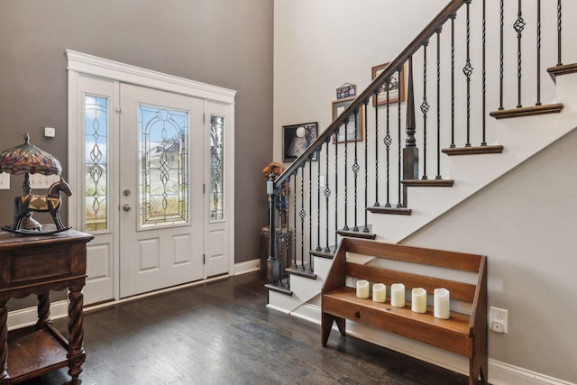 foyer entrance with dark hardwood / wood-style flooring