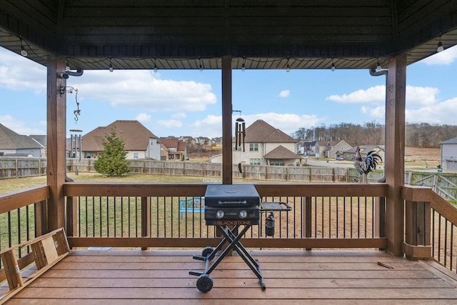 deck featuring area for grilling and a yard