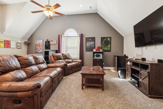 living room with vaulted ceiling, light colored carpet, and ceiling fan