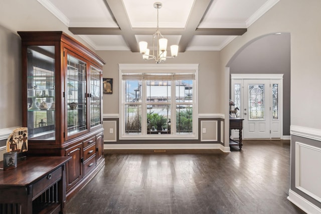 interior space featuring coffered ceiling, a notable chandelier, beam ceiling, and dark hardwood / wood-style floors