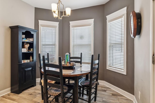 dining room with a notable chandelier