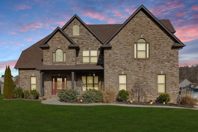 french country style house featuring a yard