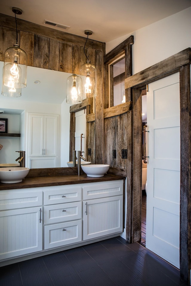 bathroom featuring vanity and wood-type flooring