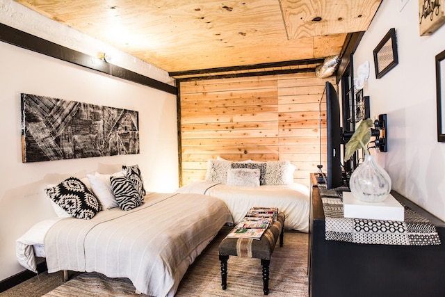 bedroom featuring wood walls and wooden ceiling