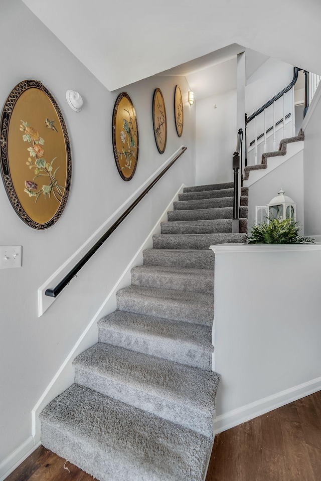 stairs with hardwood / wood-style flooring