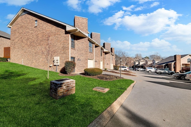 view of property exterior featuring a yard