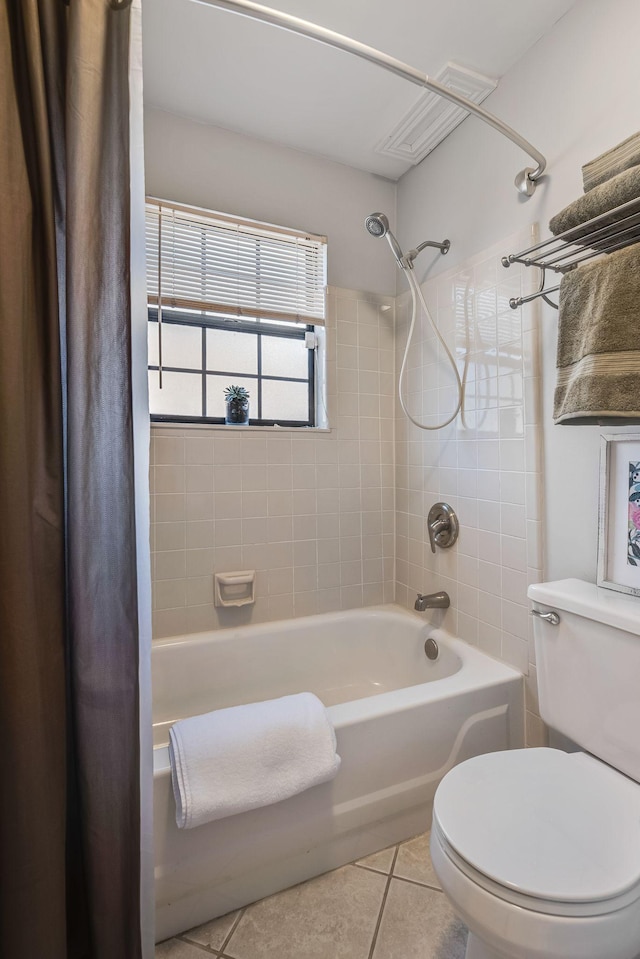 bathroom featuring shower / tub combo, tile patterned floors, and toilet